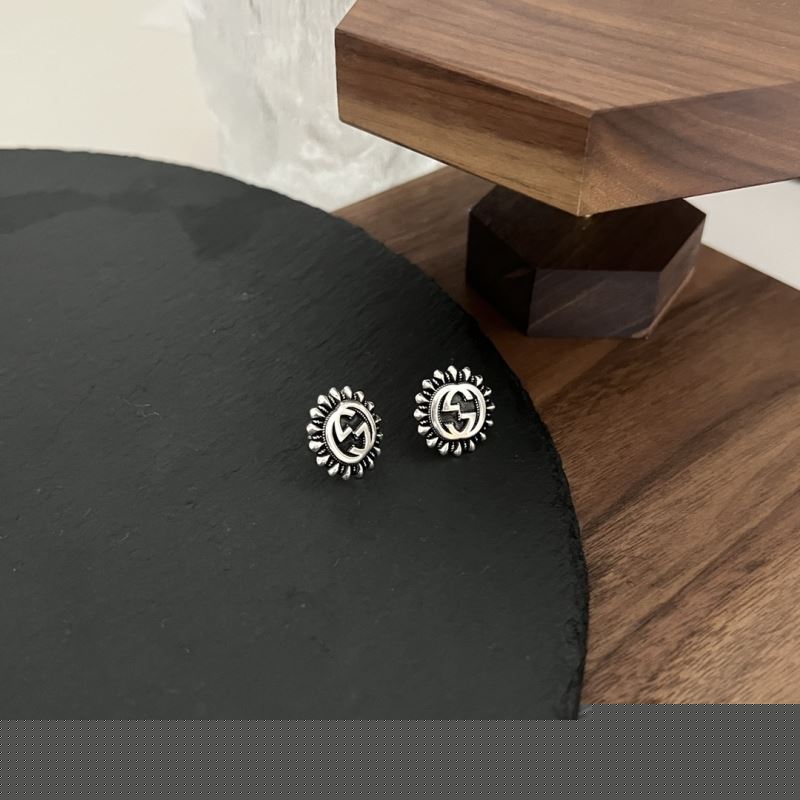 G*u*i earrings